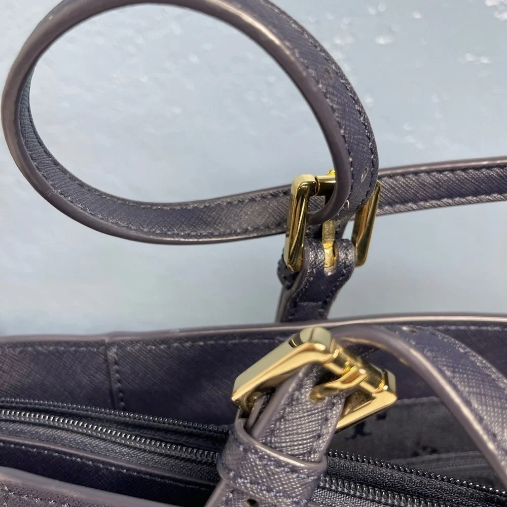 Tory Burch Saffiano leather medium Navy Blue top zip tote with material inside.